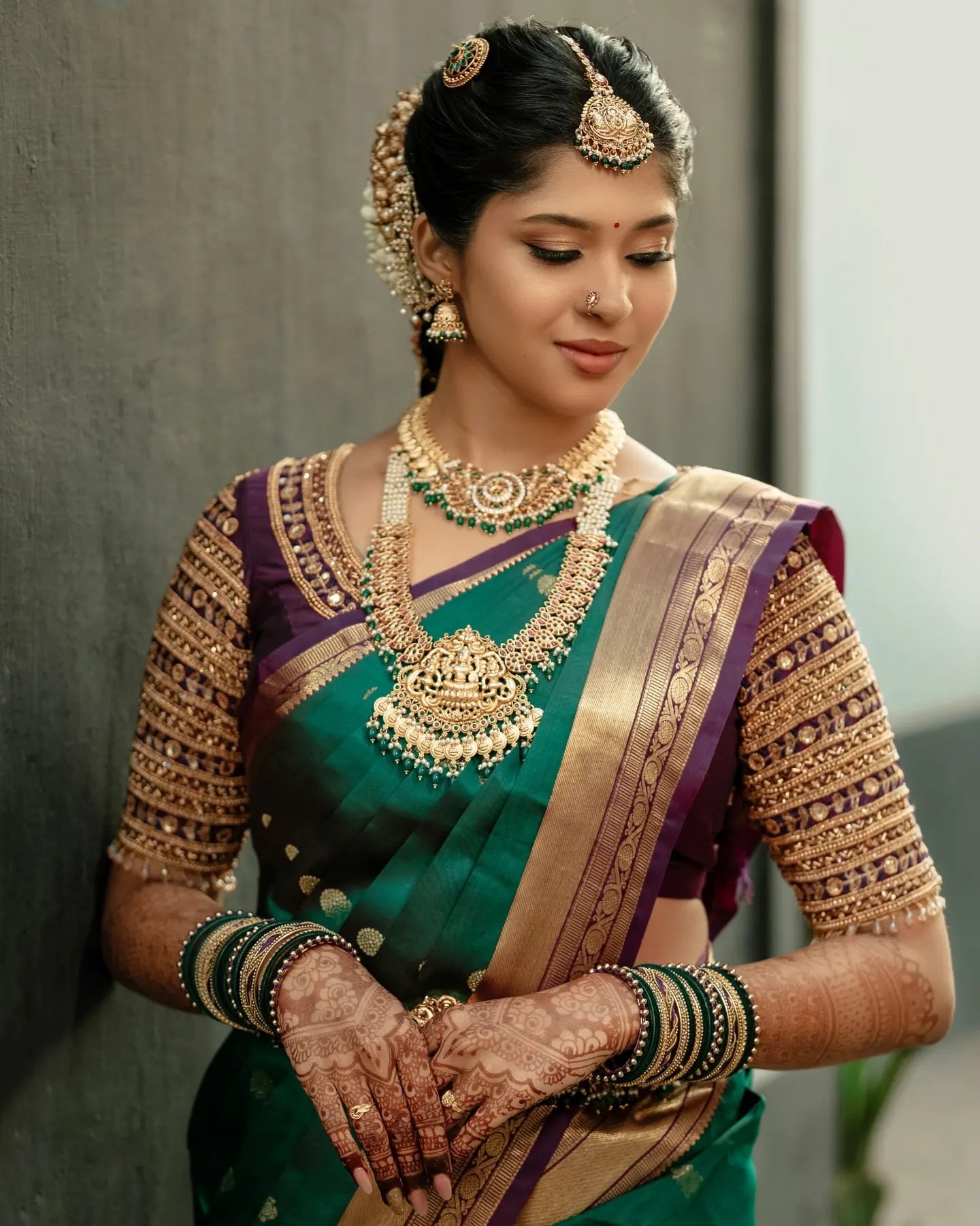 A newlywed couple embracing during traditional Kerala wedding ceremony